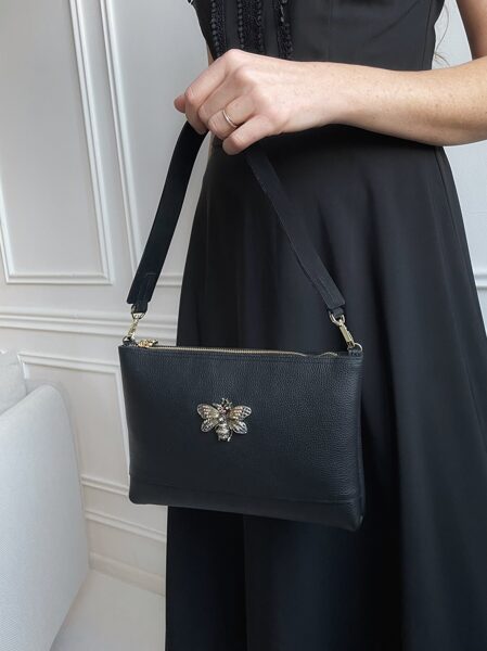 Melna plecu soma ar KARALISKO TAURENI